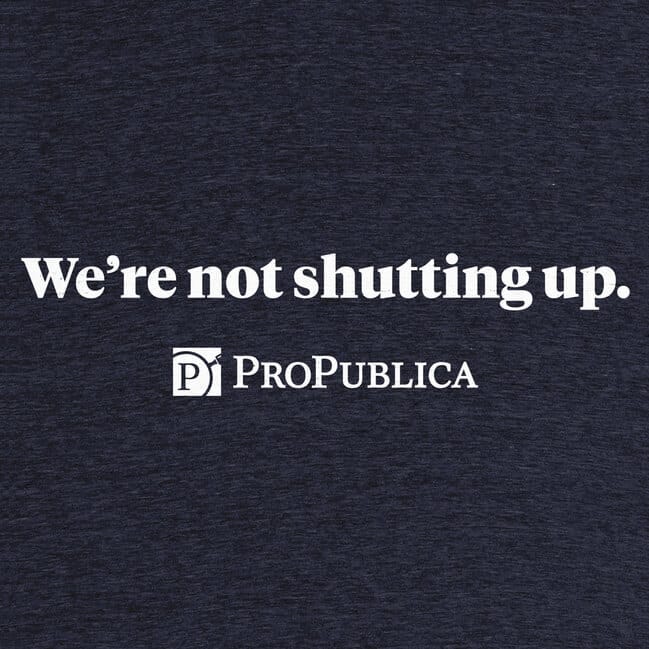 A heather blue shirt with "We're not shutting up" printed in white. Below that, the ProPublica logo.